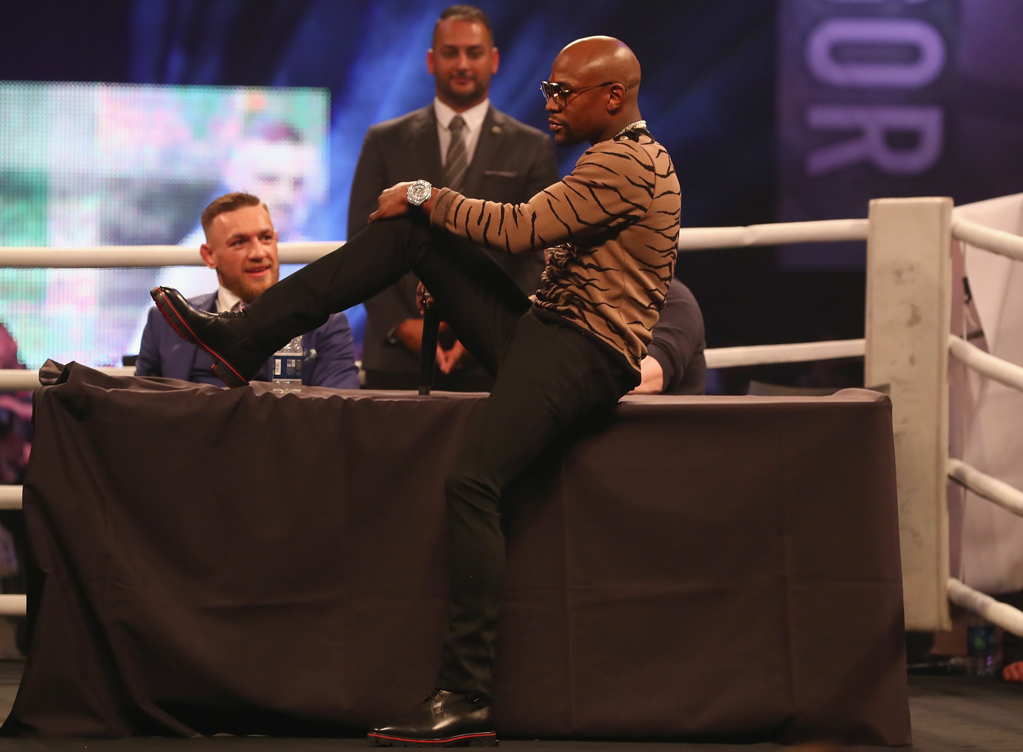 Floyd Mayweather taunts Connor McGregor at a London press conference, waving what he says is a $1.4 million Hublot Big Bang in the face of his opponent. (Photo by Matthew Lewis/Getty Images)